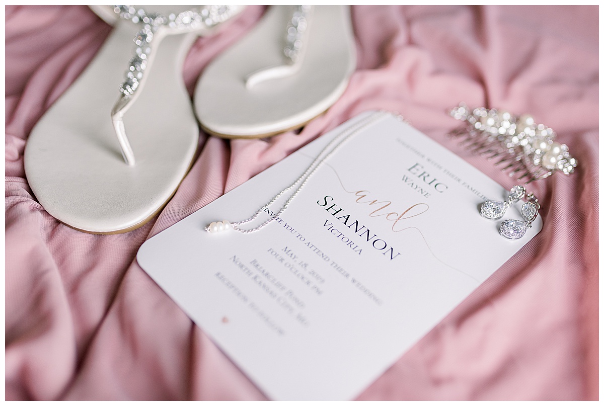 minted invitation with wedding jewelry