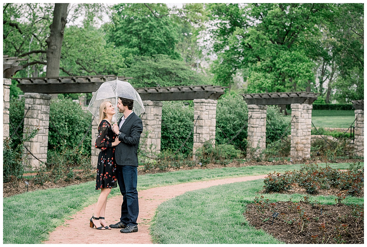 engaged couple under umbrella