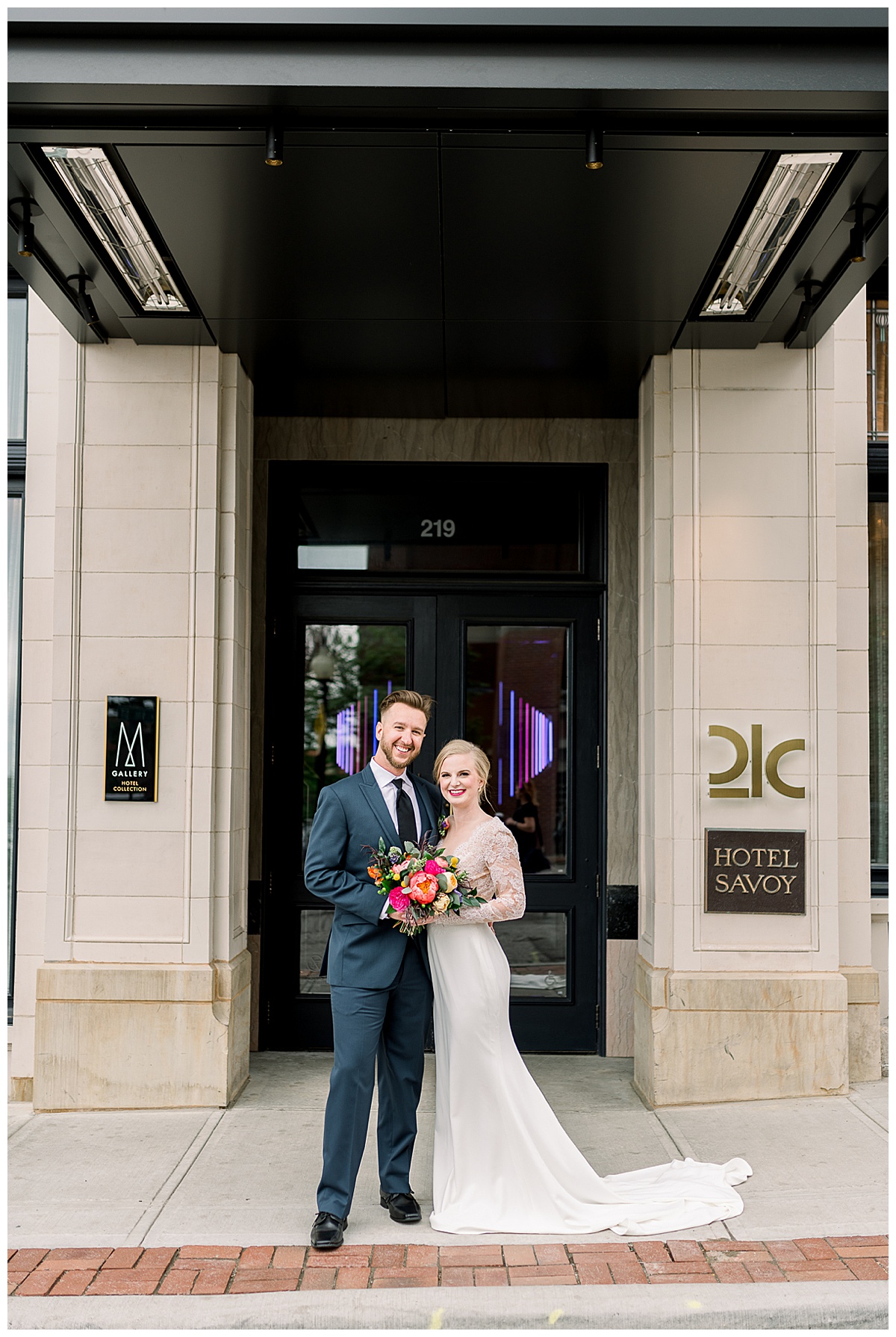 bride and groom in front of hotel