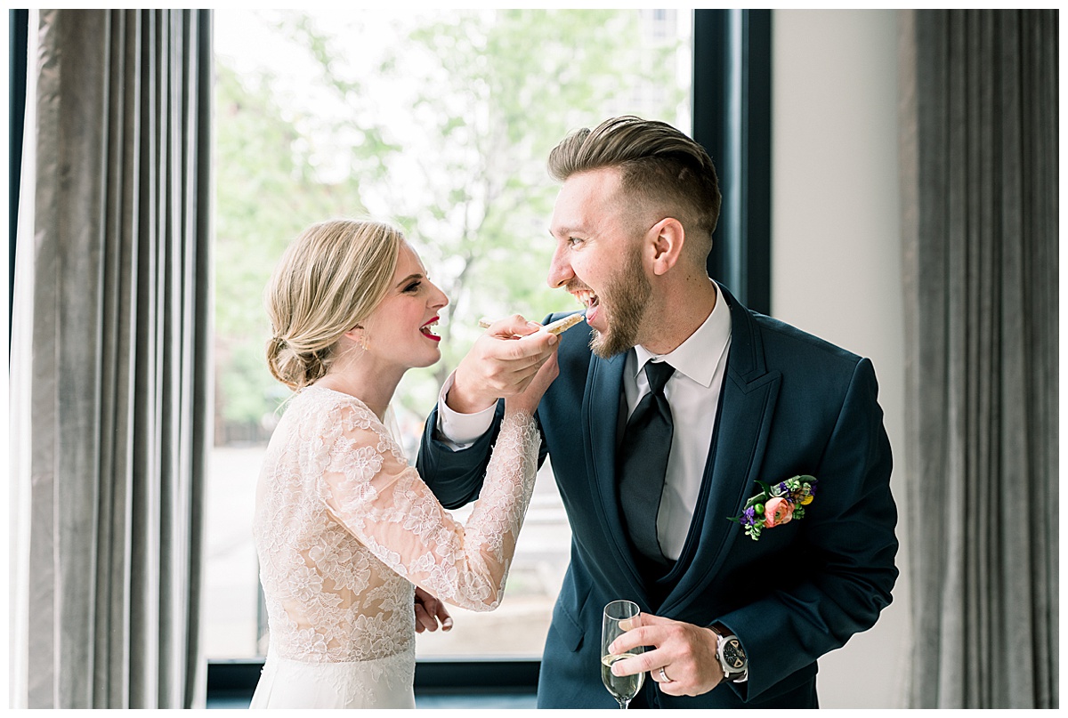 bride and groom eating cookie