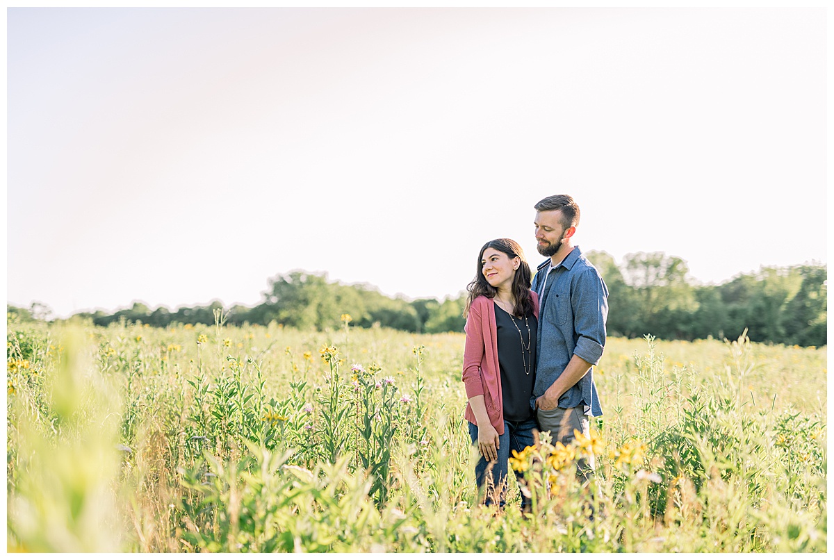 engagement photo in field of wild flowers