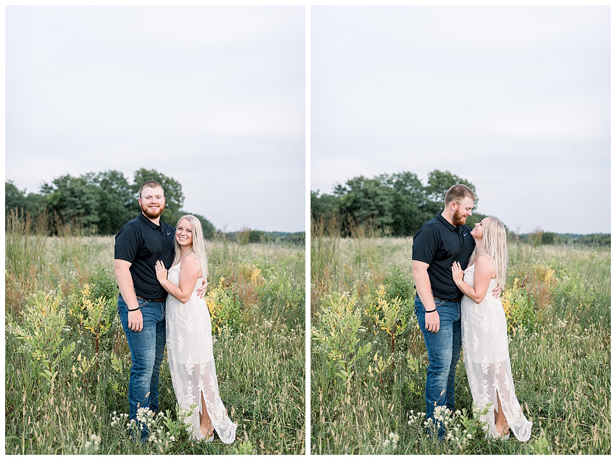 couple standing in field shawnee mission park engagement
