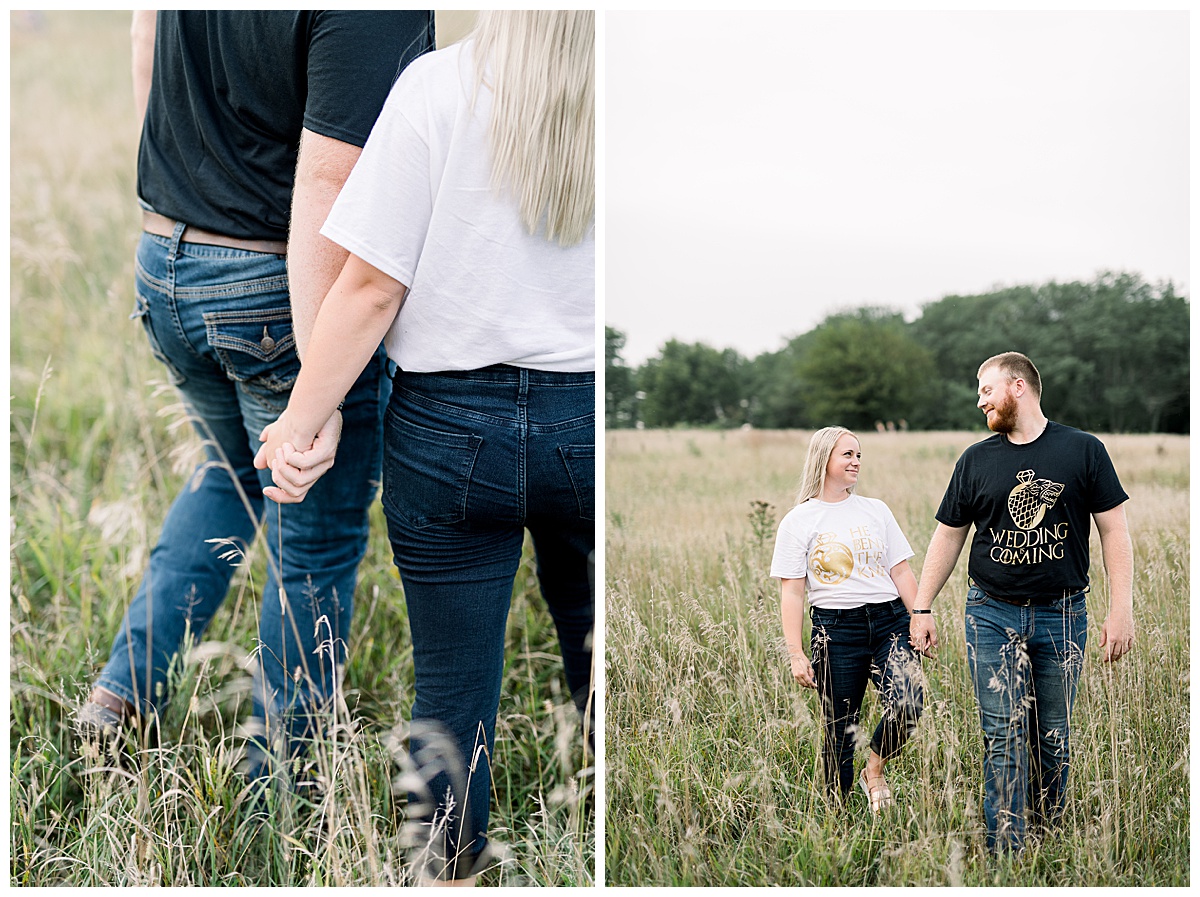couple walking in field engagement photo