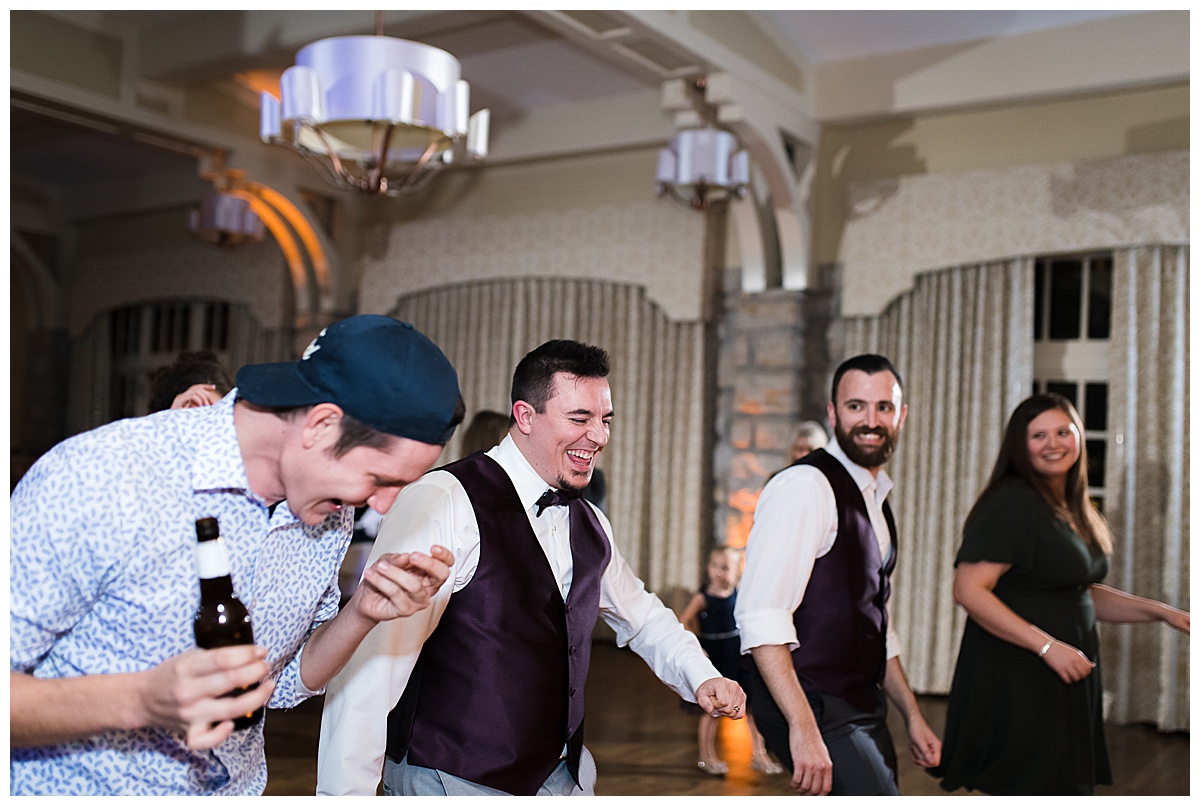 groom dancing at wedding
