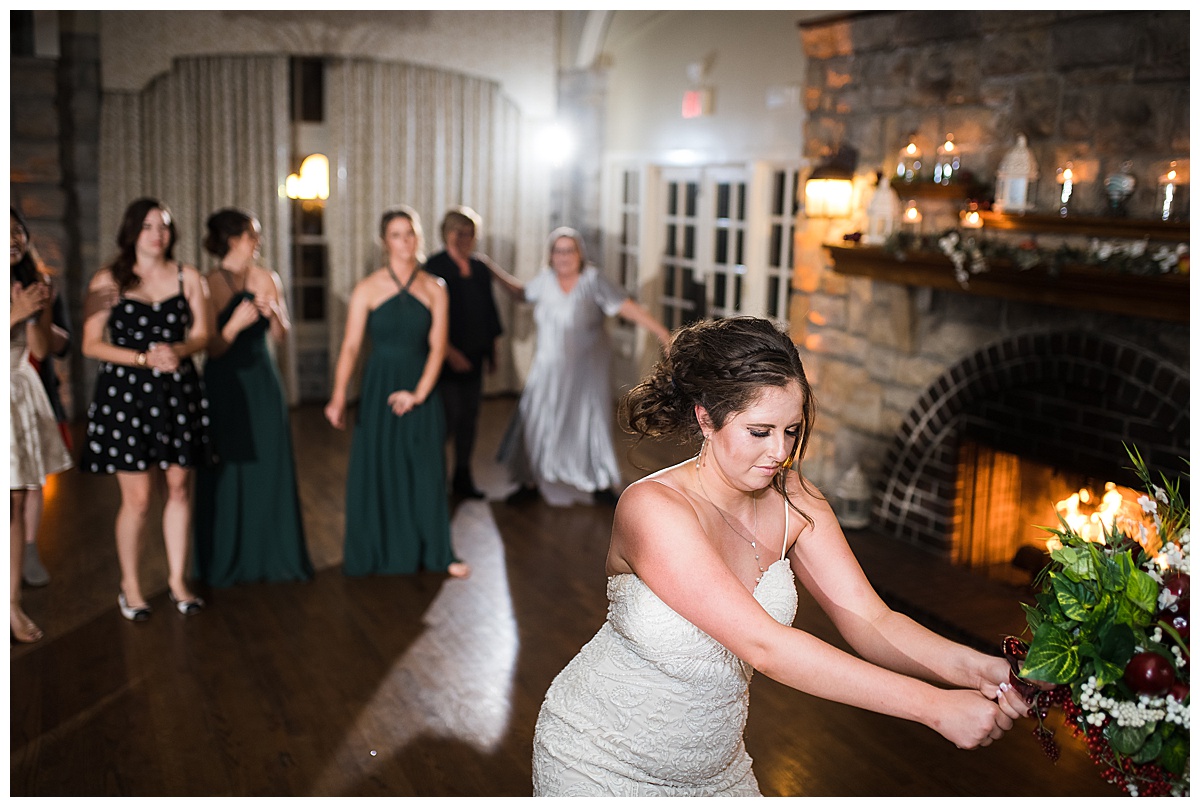 bride tossing bouqet elms hotel wedding